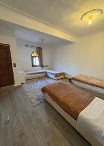 a bedroom with two beds and a window at Daryussef 114 in Marrakech