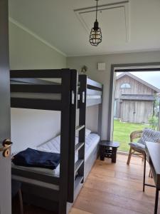 Ένα ή περισσότερα κρεβάτια σε δωμάτιο στο Newly built accommodation close to sea & nature, Varberg