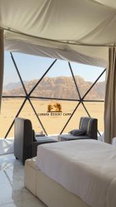 Ένα ή περισσότερα κρεβάτια σε δωμάτιο στο Lunara Desert Camp