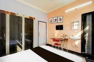 Μια τηλεόραση ή/και κέντρο ψυχαγωγίας στο Super Hotel O zanu sunidhi guest inn +23 φωτογραφίες