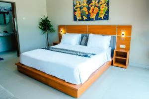 Postel nebo postele na pokoji v ubytování Nada Garden Villas 3 Bedroom - Lovina Buleleng Bali