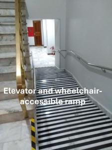 a set of stairs in a room with a stair railing at Cozy and comfort bedroom in a private Fancy Condo, safety neighborhood only 20 minutes by car from event - COP30! in Belém