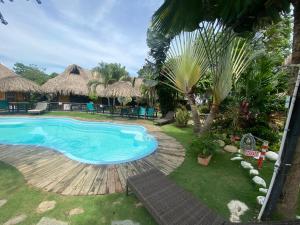 a swimming pool at a resort with a resort at Bikini Hotel & Pool in Palomino +29 photos