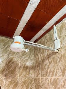 a shower head on the wall of a room at Pousada Verdes Mares in Rio das Ostras +51 photos