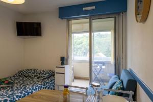 Postel nebo postele na pokoji v ubytování Bleu Cabine - Studio - Loggia