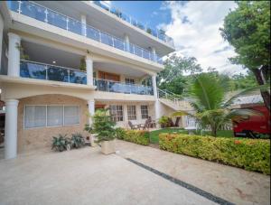 an exterior view of a house at Fully Equipped New 3br Apt dt 2mins To The Beach in Sosúa