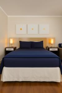 Postel nebo postele na pokoji v ubytování BOOK A FLAT Gran plaza Paulista