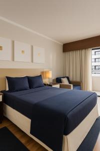 Postel nebo postele na pokoji v ubytování BOOK A FLAT Gran plaza Paulista