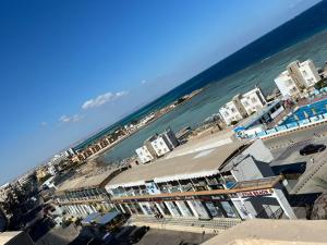 an aerial view of a beach with buildings and the ocean at Sea view hotel in Hurghada