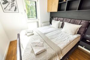 Postel nebo postele na pokoji v ubytování Nowe kameralne Apartamenty Graniczna2G Niechorze - sosnowy las i bardzo blisko plaży