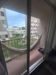 a view of a balcony with a hammock from a window at Apartamento amoblado in Girardot