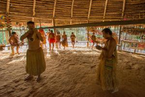 a group of people standing in a building at Irapay Amazon Lodge in Padre Cocha