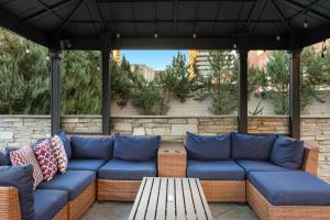a blue couch sitting under an umbrella on a patio at WorldMark Reno in Reno