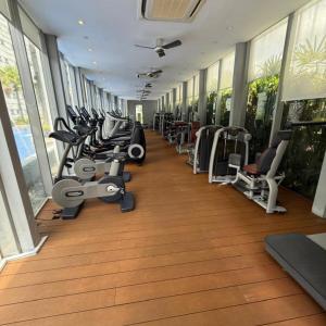 a gym with treadmills and exercise equipment in a building at Vortex luxury apartment by KL in Kuala Lumpur