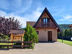 a small house with a brown roof at Mountain house Popović Tara in Bajina Bašta