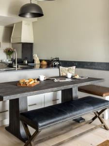 a kitchen with a large table with a counter top at RMR: Four Seasons I 6 Condo in Teton Village in Teton Village