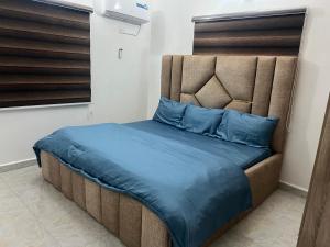 Postel nebo postele na pokoji v ubytování Exotic 3 bedroom apartment in Wuye