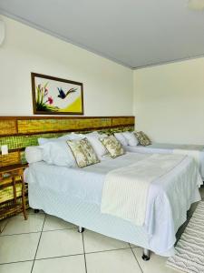 Ένα ή περισσότερα κρεβάτια σε δωμάτιο στο Casa Rústica e Moderna em Búzios!