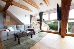 a living room with a couch and a table at Panoramablick Bucklige Welt in Edlitz