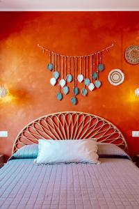 a bedroom with a bed with hearts on the wall at Vista Mare Luxury Rooms & Apartments in Margherita di Savoia +31 photos