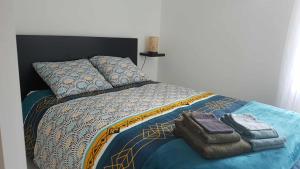 Postel nebo postele na pokoji v ubytování le Nid d Annie