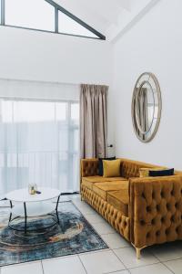 a living room with a couch and a table at Ihita unit 11 in Sandton