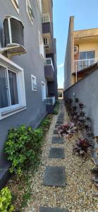 a walkway next to a building next to a building at MM Apart Premium Joinville in Joinville