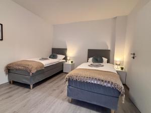Postel nebo postele na pokoji v ubytování Apartment-Topnik Datteln