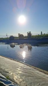 a body of water with the sun reflecting in it at Departamentos rancagua in Rancagua