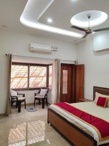 a bedroom with a bed and a ceiling fan at Pushp-Raj in Jodhpur +47 photos