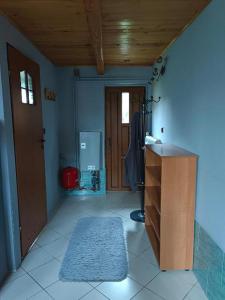 a room with a room with a door and a rug at Sosnowa Polana in Lipinki +17 photos