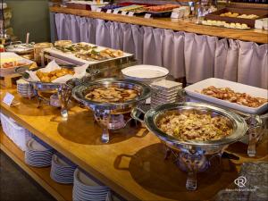 a buffet with many different types of food on a table at Daiwa Roynet Utsunomiya in Utsunomiya