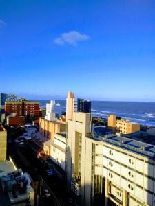 a view of a city with buildings and the ocean at San Bernardo in San Bernardo