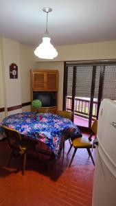 a living room with a table with a blue table cloth at San Bernardo in San Bernardo