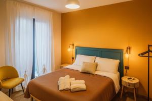 Postel nebo postele na pokoji v ubytování Casa AlmaMare
