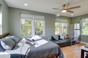 a bedroom with a bed and a couch at Commuters Dream! Cheverly Studio half Mi to Metro in Cheverly