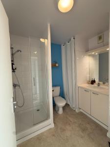 a bathroom with a shower and a toilet and a sink at Appart'Hôtel - Avignon Gare TGV in Avignon