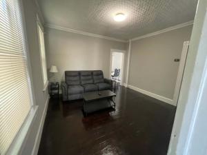 a living room with a couch and a table at Apartment in Middletown-Wesleyan102 in Middletown +12 photos