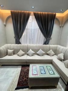 Posezení v ubytování اللثبية للشقق الفندقية