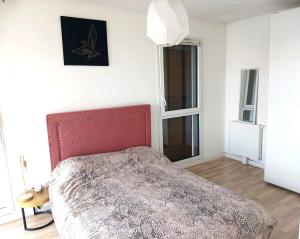 Postel nebo postele na pokoji v ubytování Mini loft near Paris