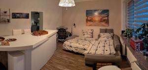 a bedroom with a bed and a desk in it at Chez D&D in Eschweiler