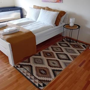 a living room with a couch and a table at Stan na dan Kalin in Bugojno