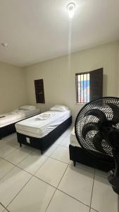 Postel nebo postele na pokoji v ubytování Garden Flat Beach