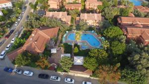 an aerial view of a house with a swimming pool at Katre Hotel Oludeniz in Oludeniz