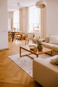 a living room with a couch and a table at JUGA Apartmány in Jaroslavice