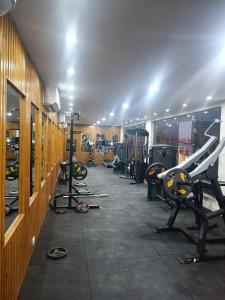 a gym with several treadmills and machines in it at Scandic resort chalet in Hurghada