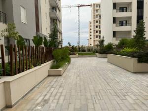 a courtyard in a building with a fence at Appartement de luxe in Sidi Daoud