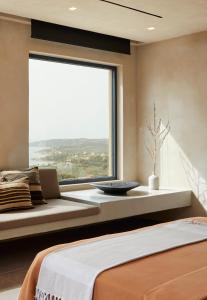 Ένα ή περισσότερα κρεβάτια σε δωμάτιο στο Villa Olivio - Secret Roc Villas