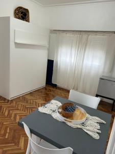 a table with a bowl of food on top of it at Pasala Lindo in Tandil