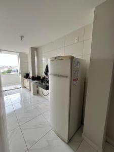 Η κουζίνα ή μικρή κουζίνα στο Acomodação aconchegante e com linda vista +19 φωτογραφίες